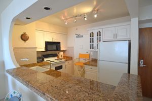Kitchen (a) - 9195 Collins Ave, Unit 1013, Surfside, FL 33154 - © Flat Fee Florida Realty